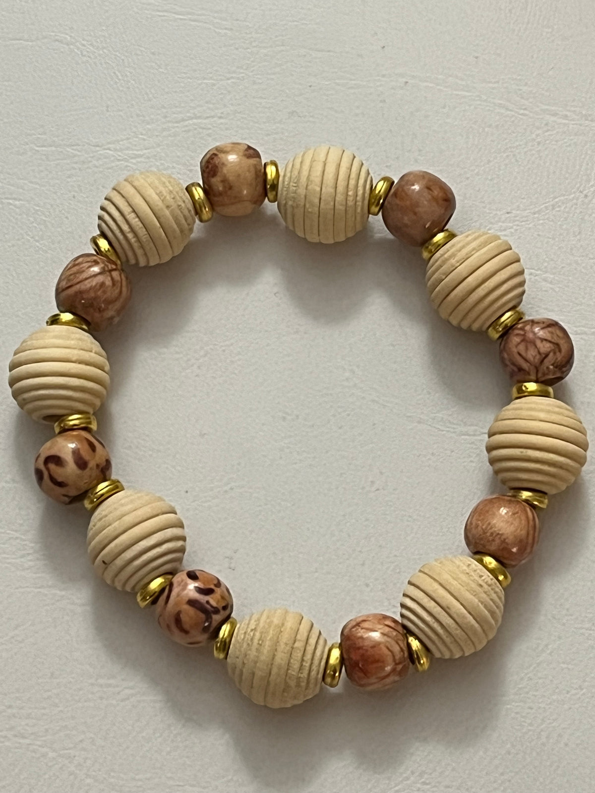 Close-up of Matching wooden bracelet with natural grain texture