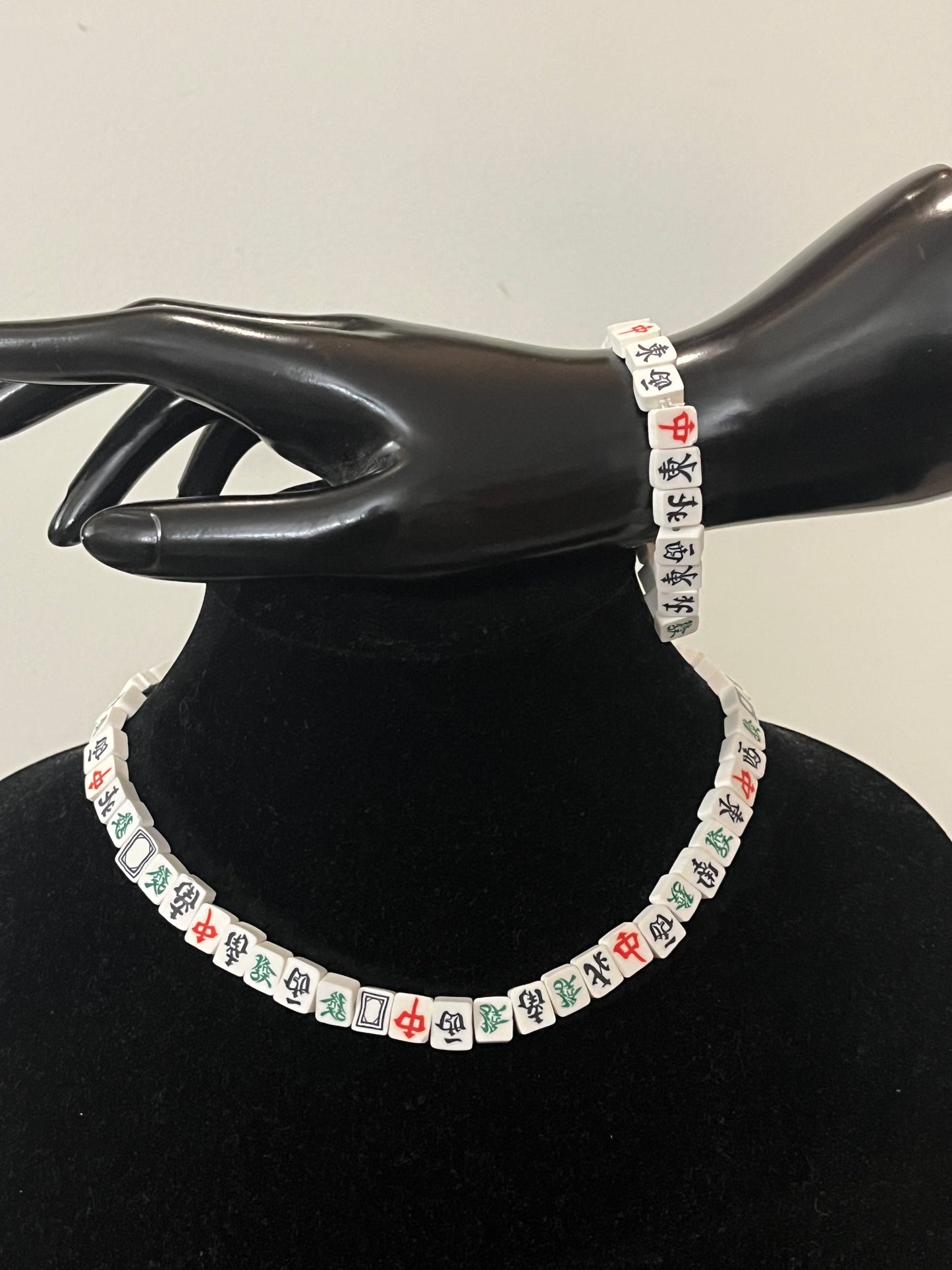 Close-up of Unique Mahjong tile jewelry set styled for game lovers