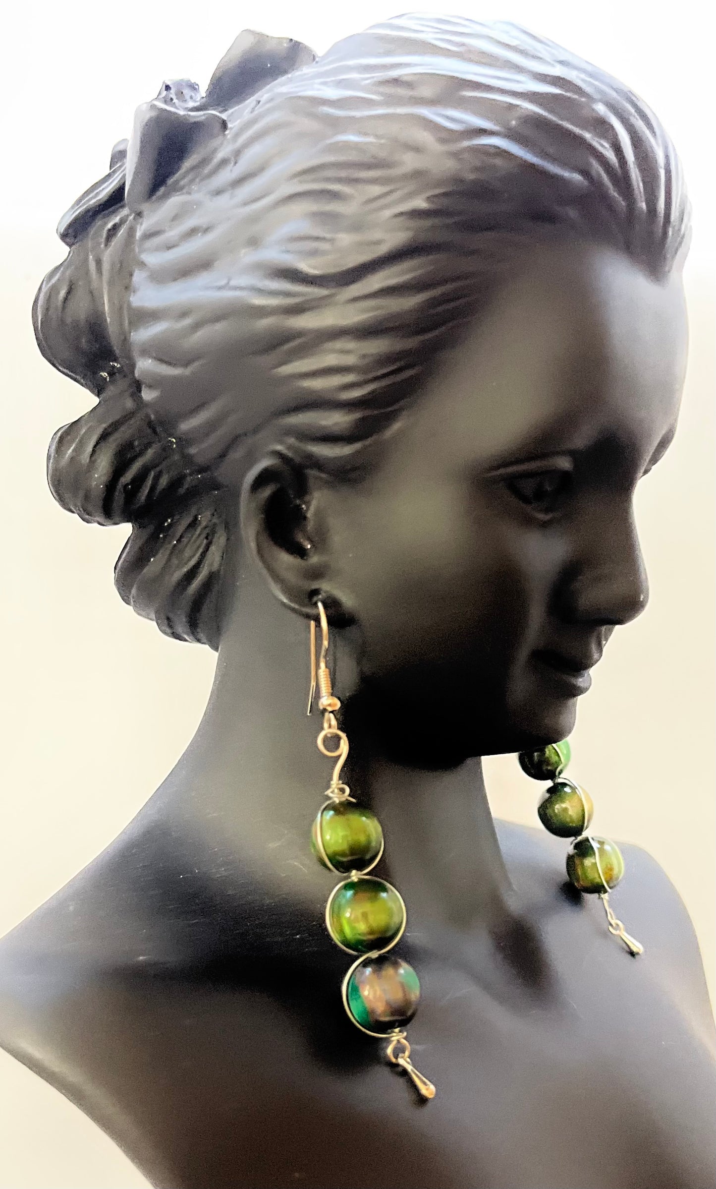Matching green earrings with elegant beadwork