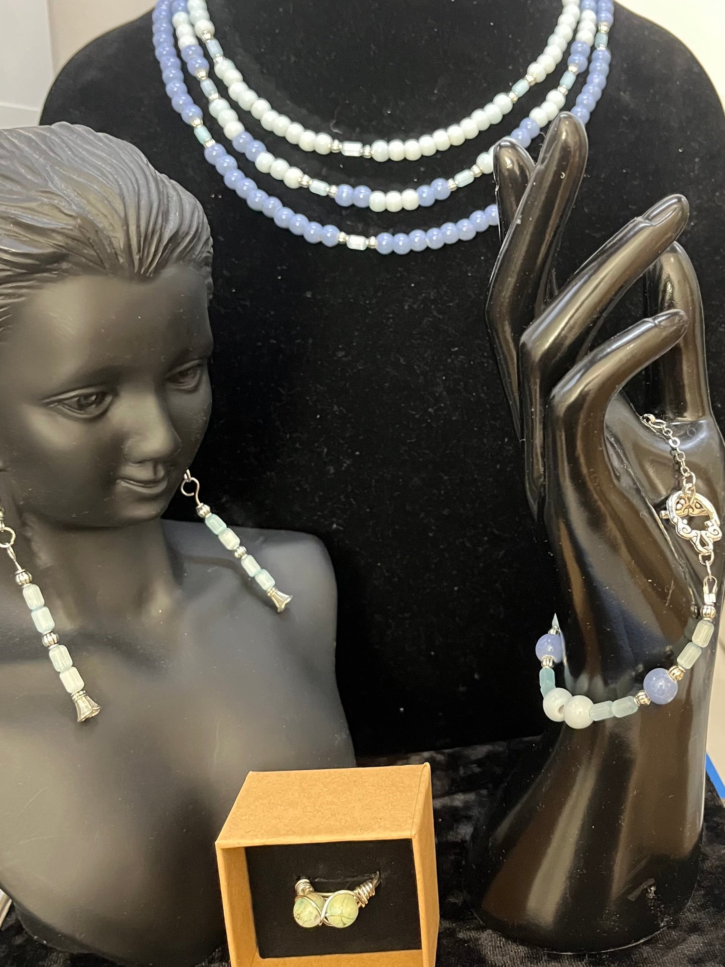 Full Lady of the Blue Court jewelry set displayed on soft backdrop