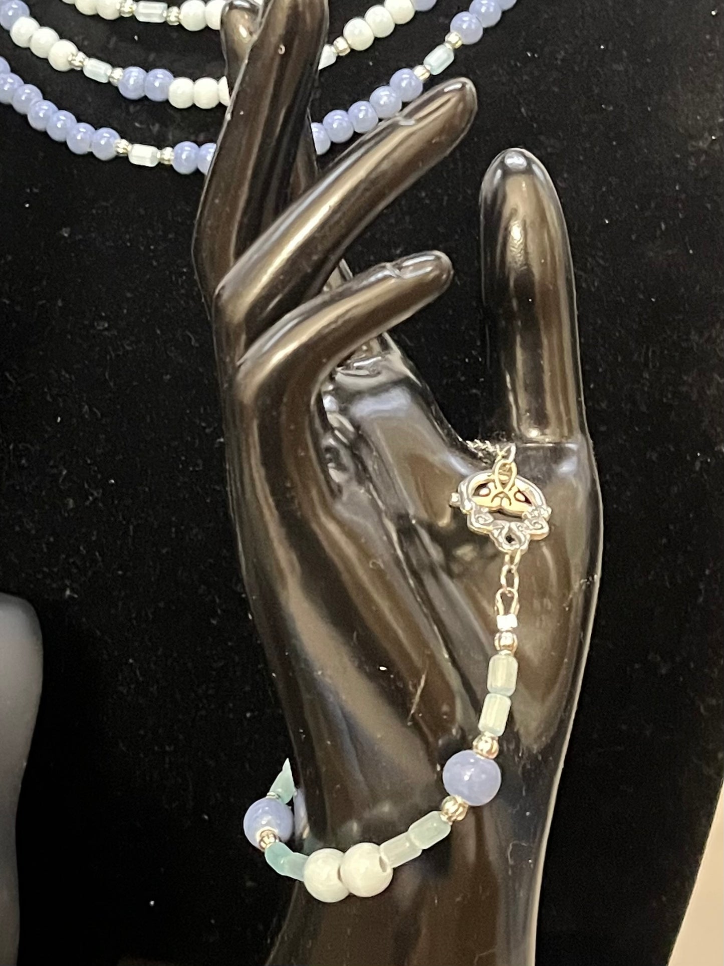 Blue gemstone bracelet with ornate silver detailing
