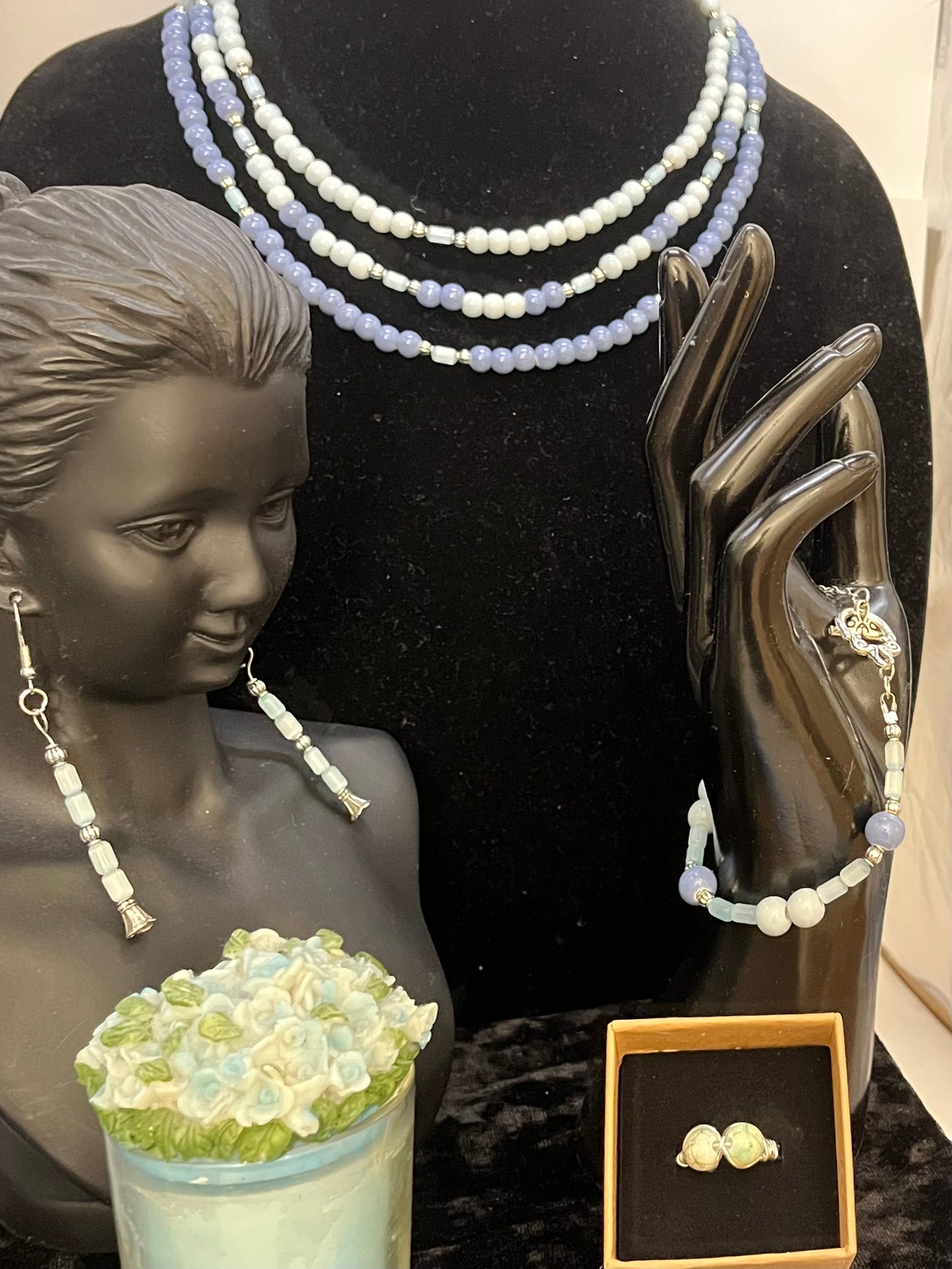 Full Lady of the Blue Court jewelry set displayed on soft backdrop