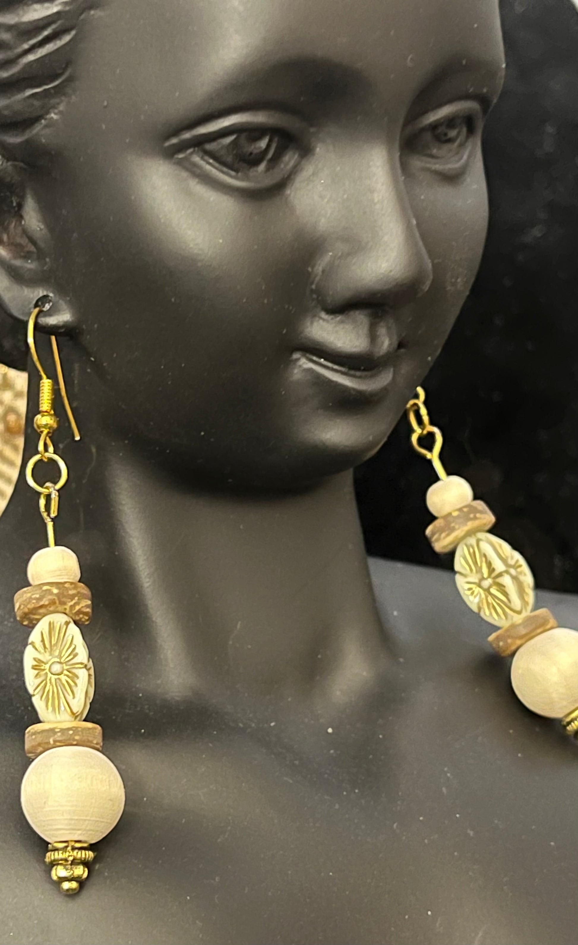 Owl earrings with carved details and earthy color palette