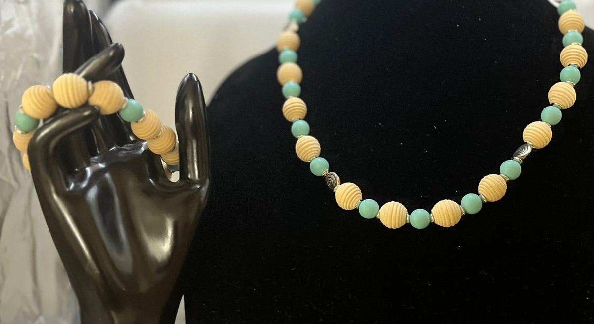 Full aqua and wood jewelry set displayed on neutral backdrop