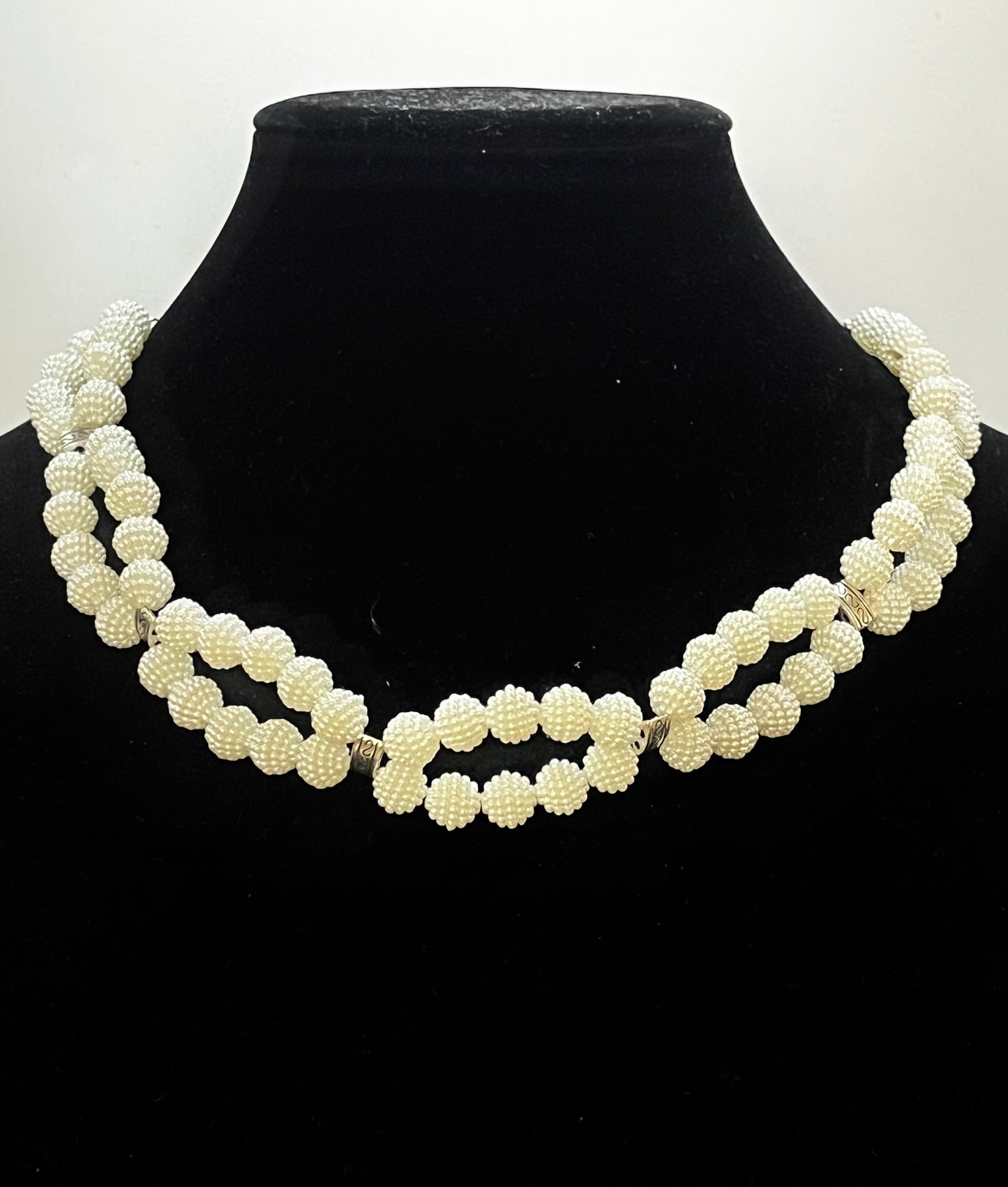 Close‑up of infinity pearl design with elegant symmetry