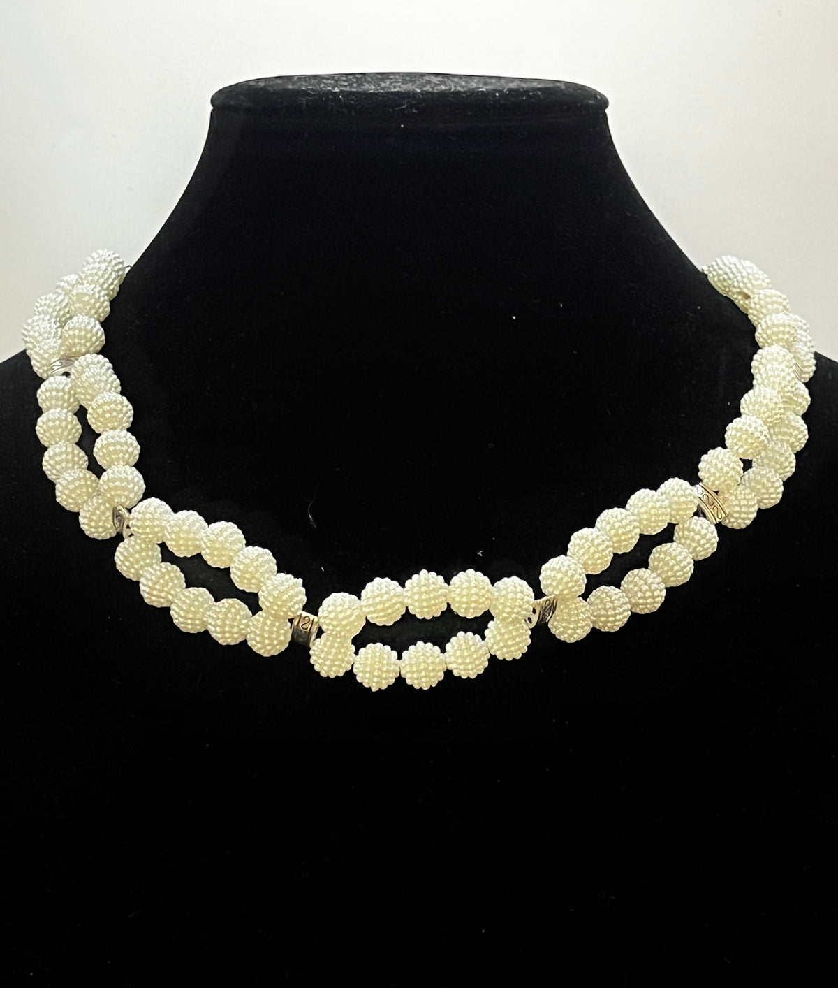Close‑up of infinity pearl design with elegant symmetry
