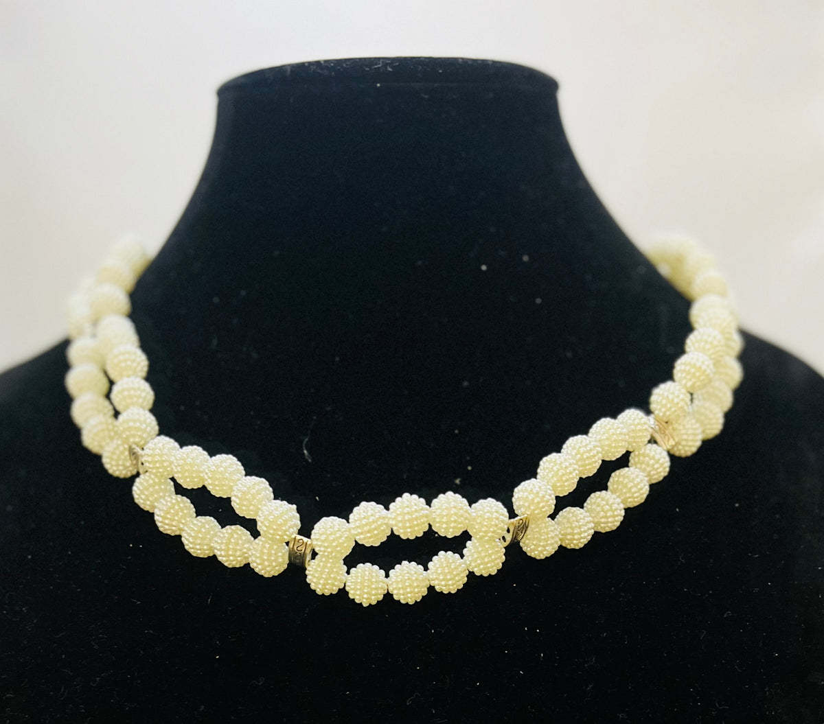Infinity pearl choker styled for classic fashion