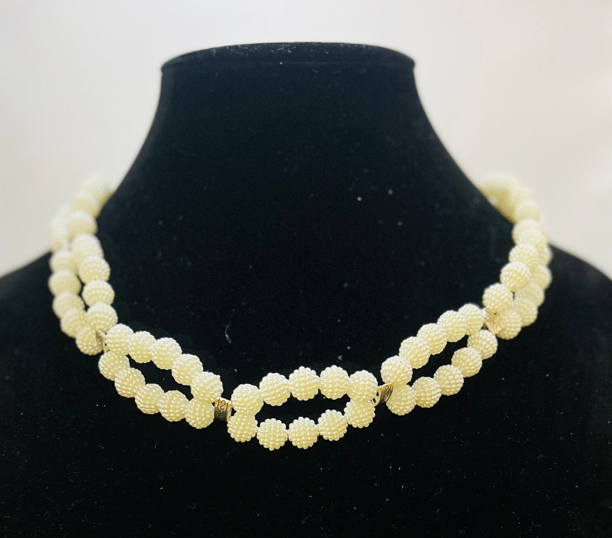 Infinity pearl choker styled for classic fashion