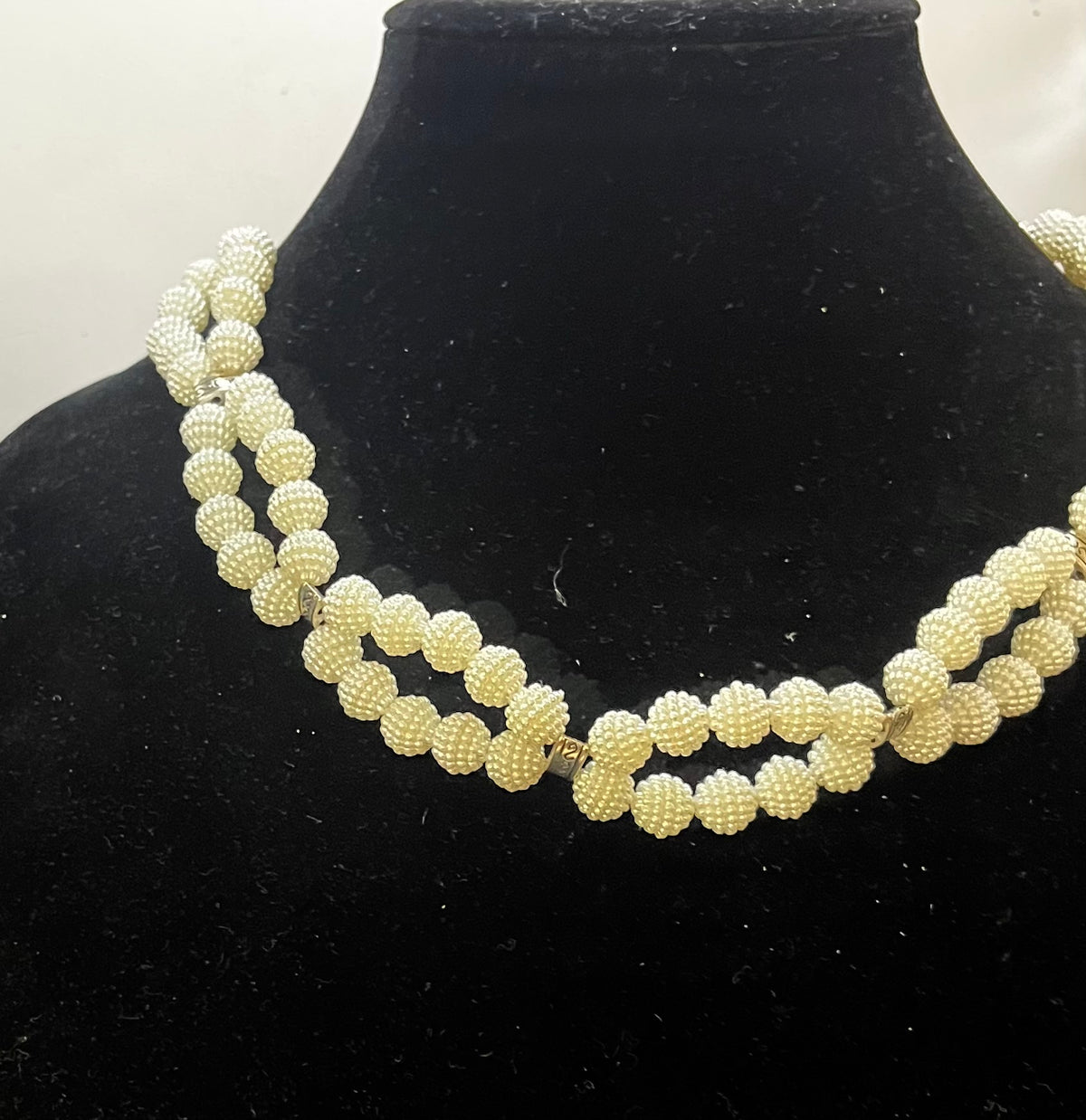 Close‑up of infinity pearl design with elegant symmetry