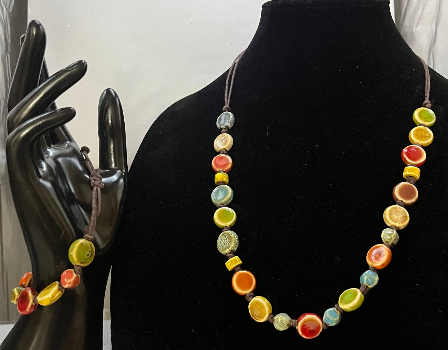 Bohemian self-adjusting handmade necklace and bracelet with rich jewel-tone ceramic beads by Eliza Joe Jewelry