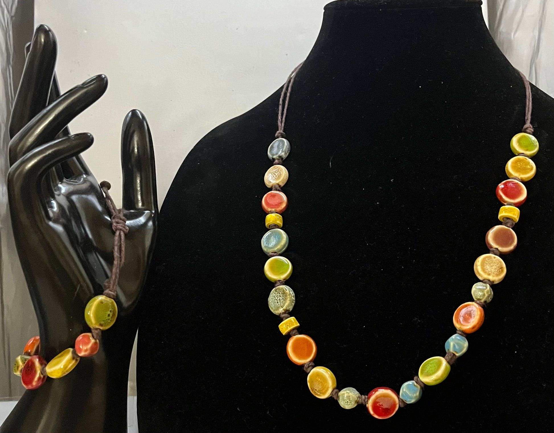 Bohemian self-adjusting handmade necklace and bracelet with rich jewel-tone ceramic beads by Eliza Joe Jewelry