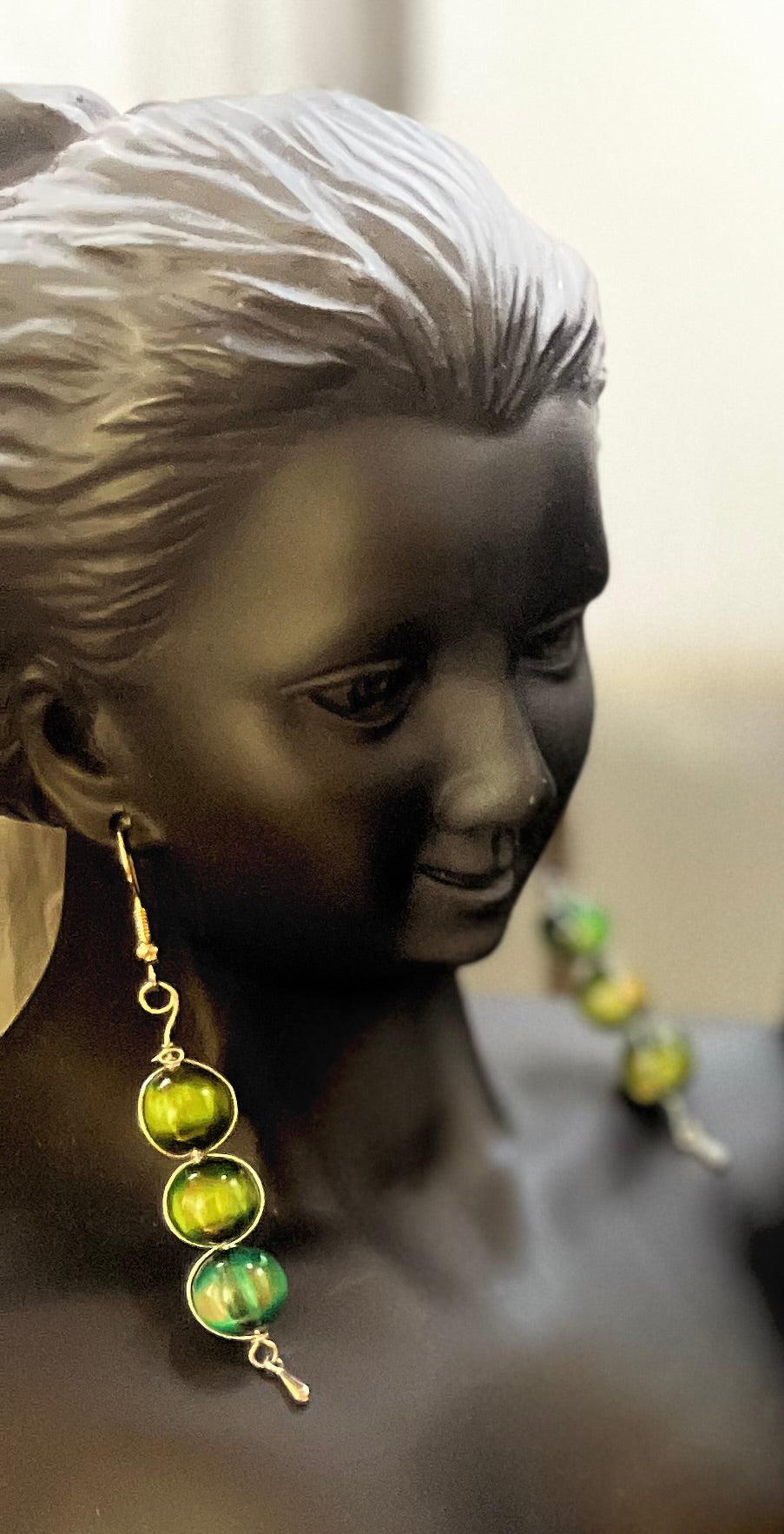 Matching green earrings with elegant beadwork