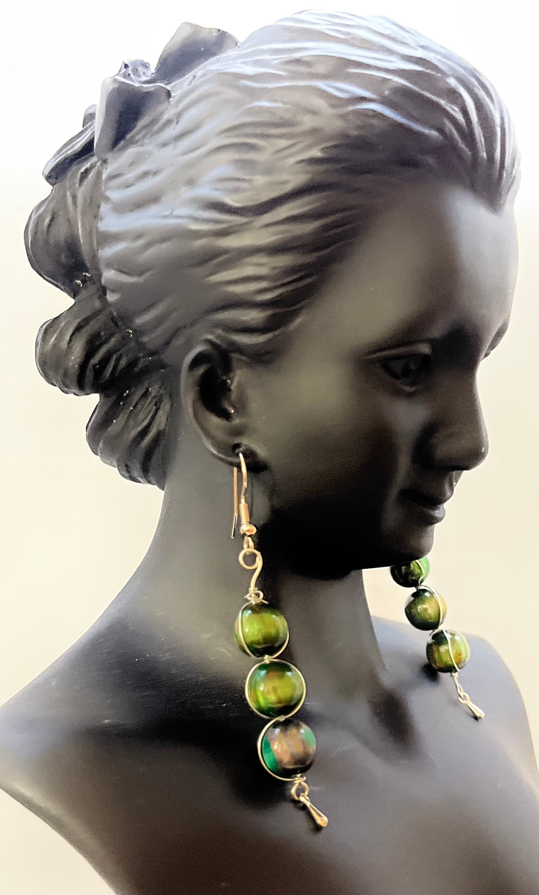 Matching green earrings with elegant beadwork