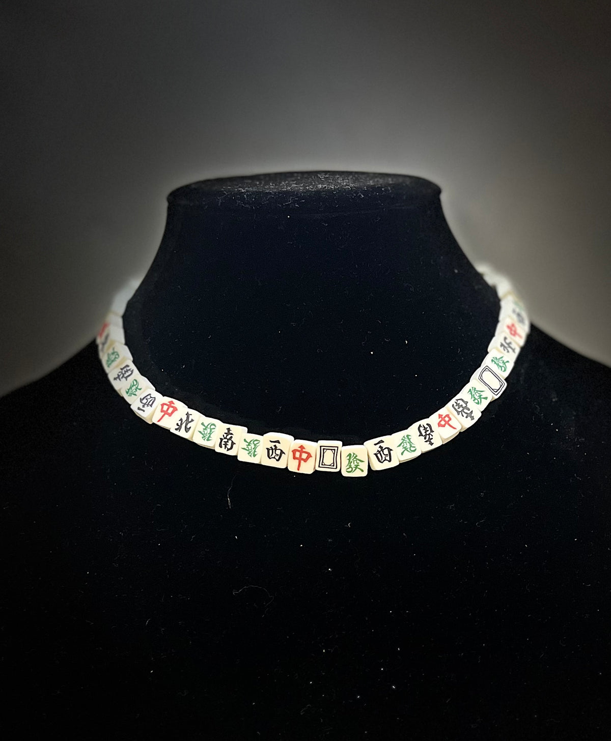 Mahjong tile necklace with fun, quirky aesthetic