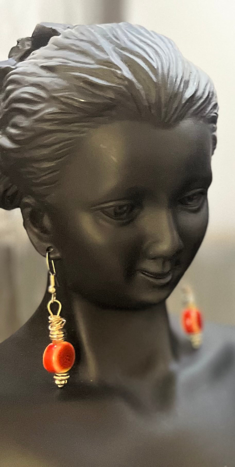 Matching red ceramic earrings with bold color