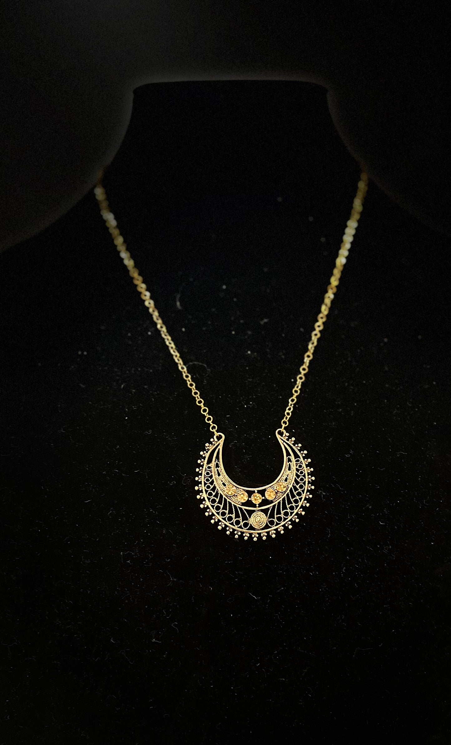 Egyptian‑inspired necklace with gold accents and goddess motif for dramatic fashion