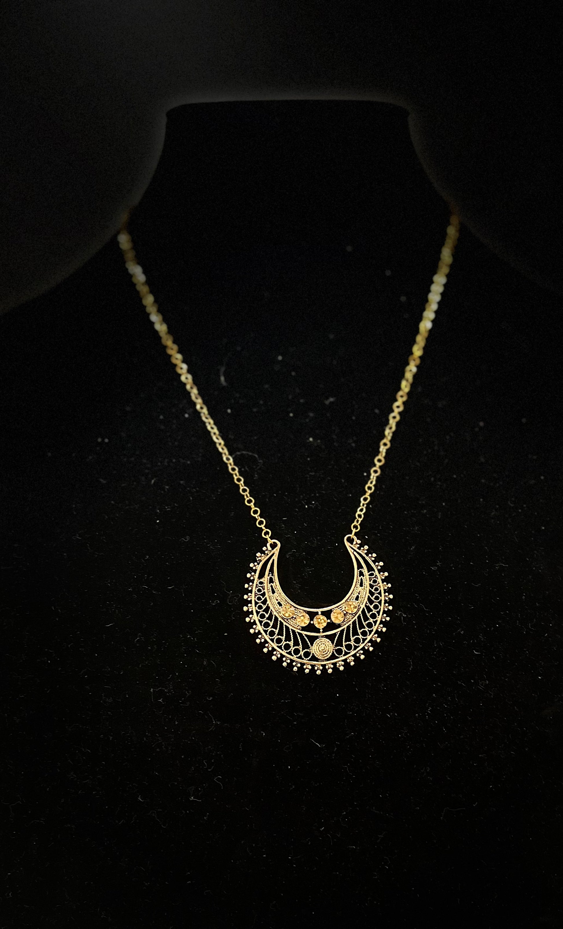Egyptian‑inspired necklace with gold accents and goddess motif for dramatic fashion
