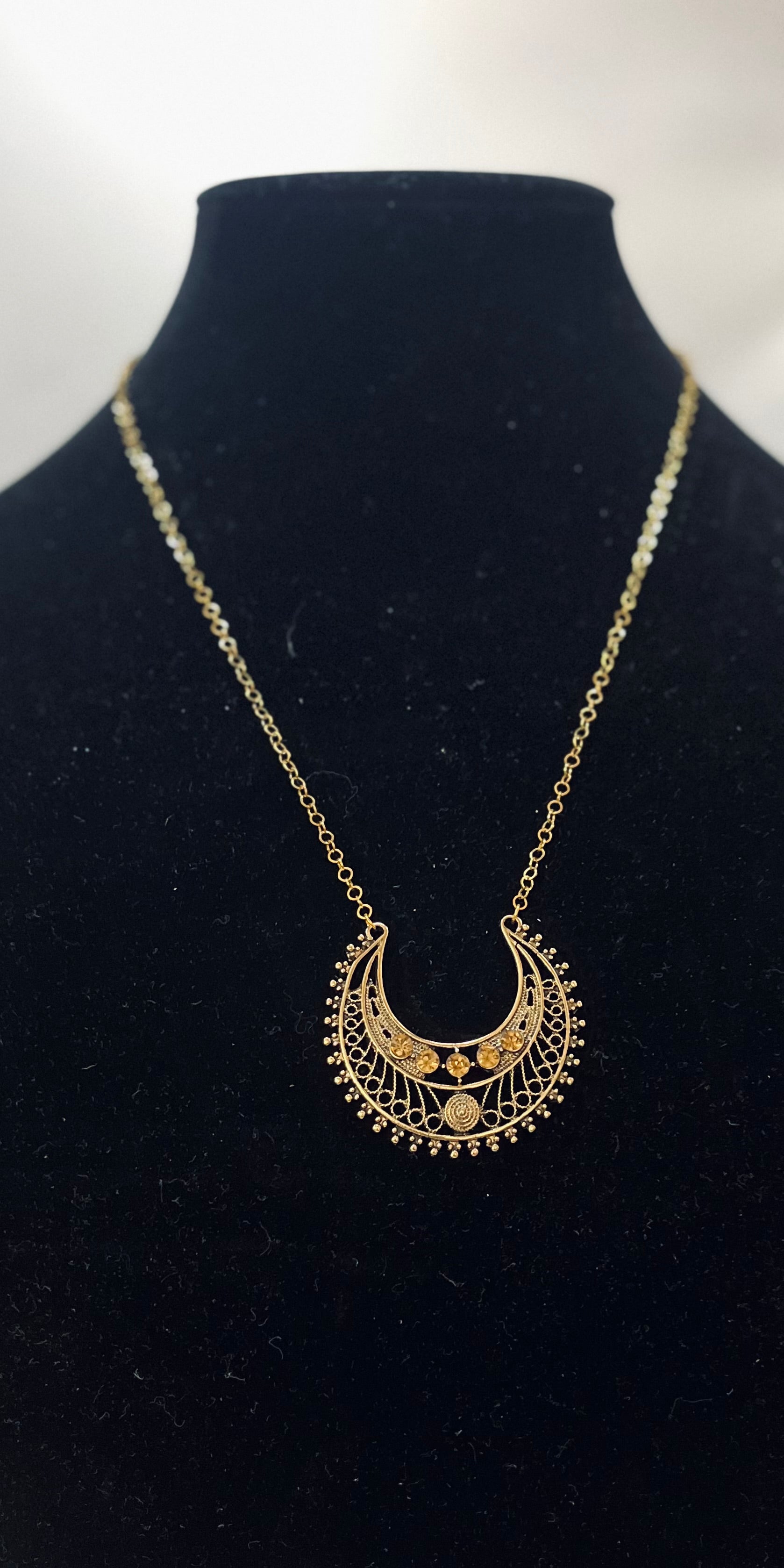 Egyptian‑inspired necklace with gold accents and goddess motif