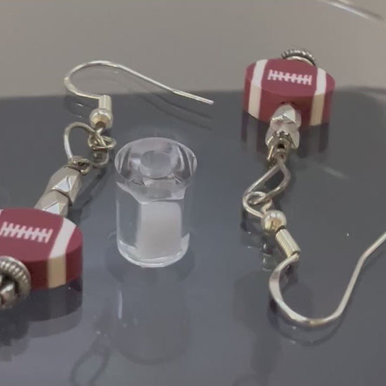 Football fans detail view of earrings full view by Eliza Joe Jewelry