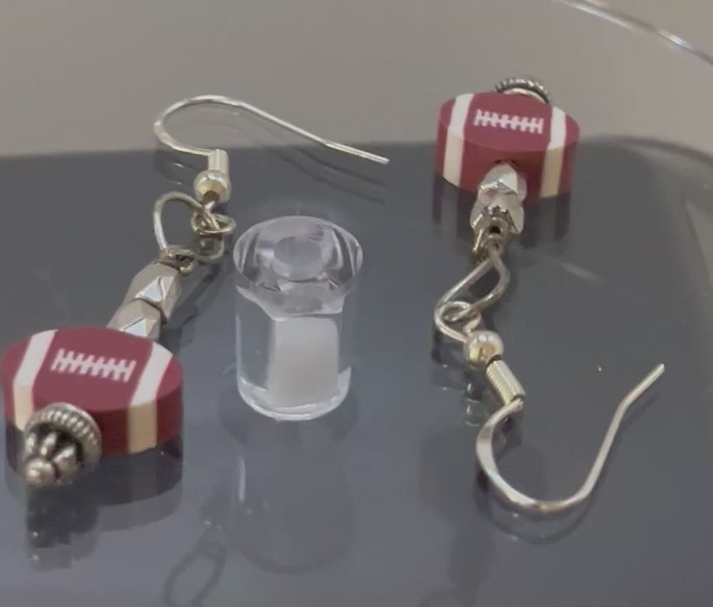 Football fans detail view of earrings full view by Eliza Joe Jewelry